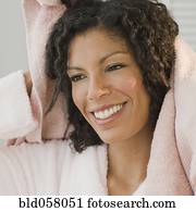 African woman drying hair