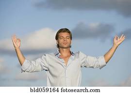 Hispanic man meditating