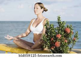 Hispanic woman meditating