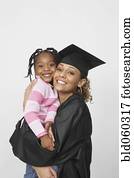 African female graduate holding daughter