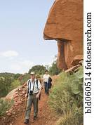 Multi-ethnic senior couple hiking in desert Multi-ethnic senior couple hiking in desert