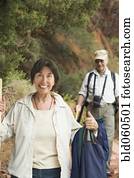 Multi-ethnic senior couple hiking Multi-ethnic senior couple hiking