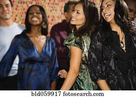 Multi-ethnic women dancing at party