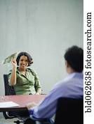 African businesswoman holding money paper airplane