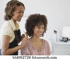 African hairdresser and client African hairdresser and client