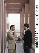 Businessmen talking outside