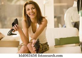 Mixed race woman shoe shopping