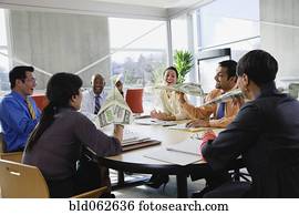 Multi-ethnic business people holding money paper airplanes