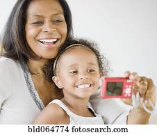 African grandmother and granddaughter smiling for self-portrait