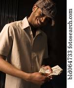 African man counting money