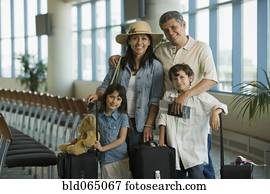 Hispanic family waiting in airport