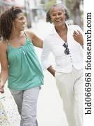 African mother and daughter walking