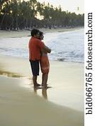 Couple hugging on beach