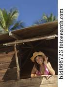 Woman in lifeguard tower at beach