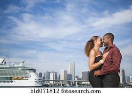 African American couple hugging