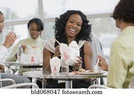 African co-workers eating lunch