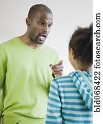 African father scolding daughter