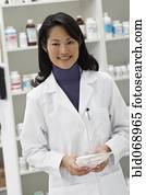 Portrait of Asian female pharmacist in pharmacy