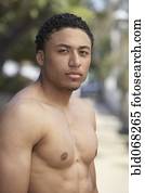 Young mixed race man with bare chest