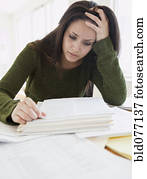 Mixed race woman frustrated over paperwork