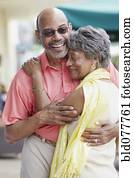 African couple hugging