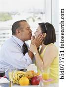 Hispanic couple kissing