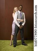 Well-dressed couple hugging