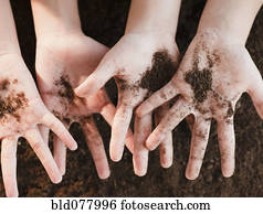 Girls holding dirt