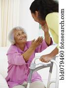 African American woman helping senior mother