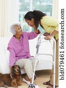 African American woman helping senior mother