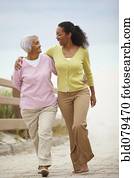 African American woman walking with mother
