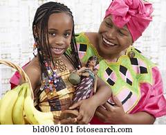 African American girl and grandmother in traditional clothing