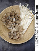 Variety of Asian mushrooms in basket