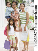 Asian family on sidewalk