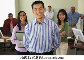 Businessman with coworkers in background