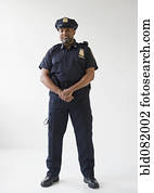African American policeman with hands clasped