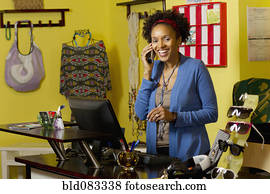 African American small business owner in clothing shop