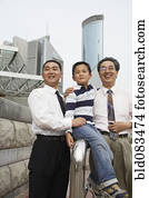 Chinese grandfather, father and son together outdoors