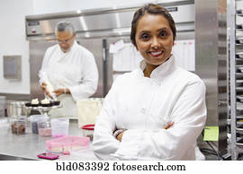 Small business owners working in bakery kitchen