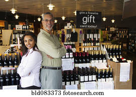Small business owners working in wine shop