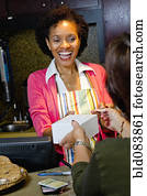 African American bakery owner taking customer's credit card