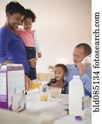 Black family eating breakfast together