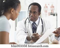 African male doctor talking to patient