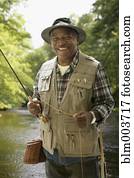 African man in fishing vest