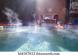 Couple relaxing in hot tub