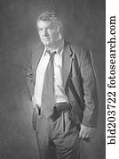 Greek businessman with hand on hip