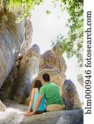 Hispanic couple looking at rock formation