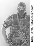 Policeman wearing machine gun and vest