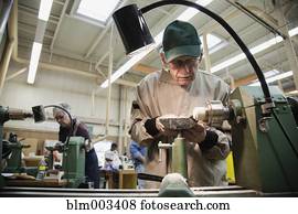 Senior man working in workshop