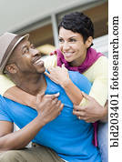 Smiling couple hugging outdoors Smiling couple hugging outdoors